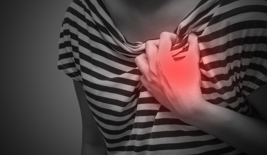 A stylised image of someone with heart disease clutching their heart