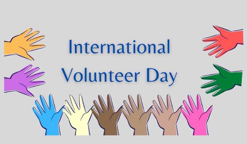 An illustrated image reading 'International Volunteer Day' surrounded by hands of different colours.